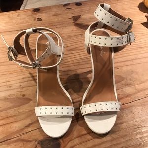 Studded buckle double strap stiletto sandals.